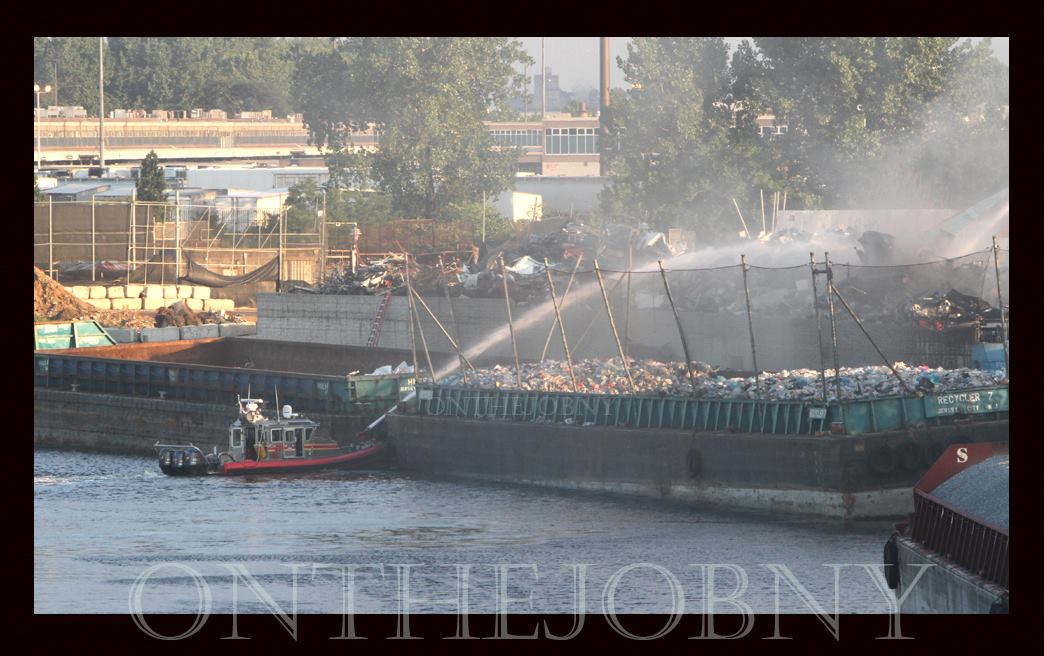 Junkyard blaze contained on waterfront