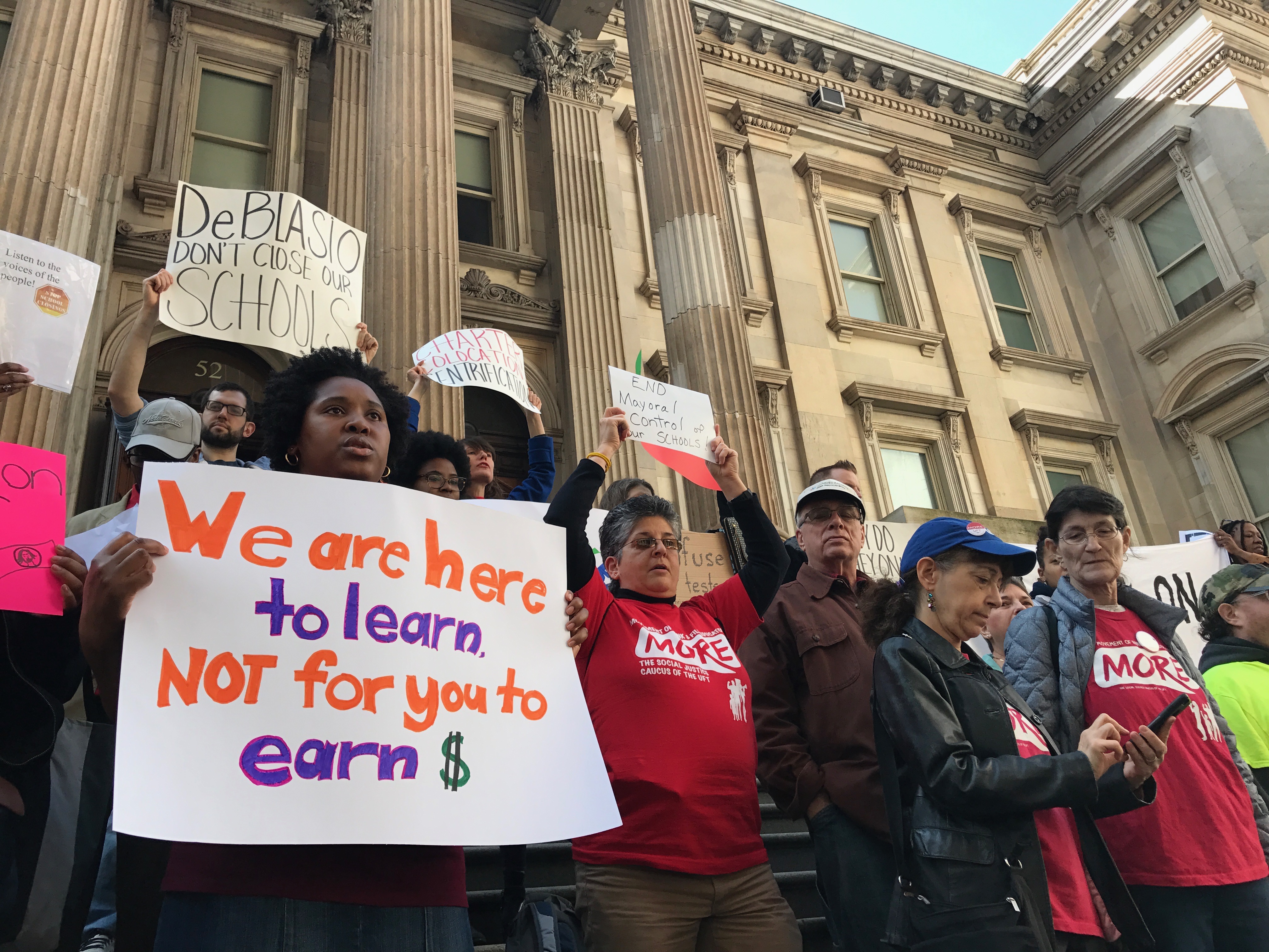 Residents rally against school merger